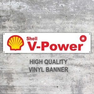 May include: White vinyl banner with a red Shell V-Power logo and a red star. The text "HIGH QUALITY VINYL BANNER" is printed below the logo.