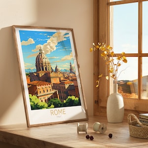 May include: A framed print of a colourful illustration of the city of Rome, Italy. The print features a large building with a dome and other buildings in the background. The print is framed in a light brown wood frame.