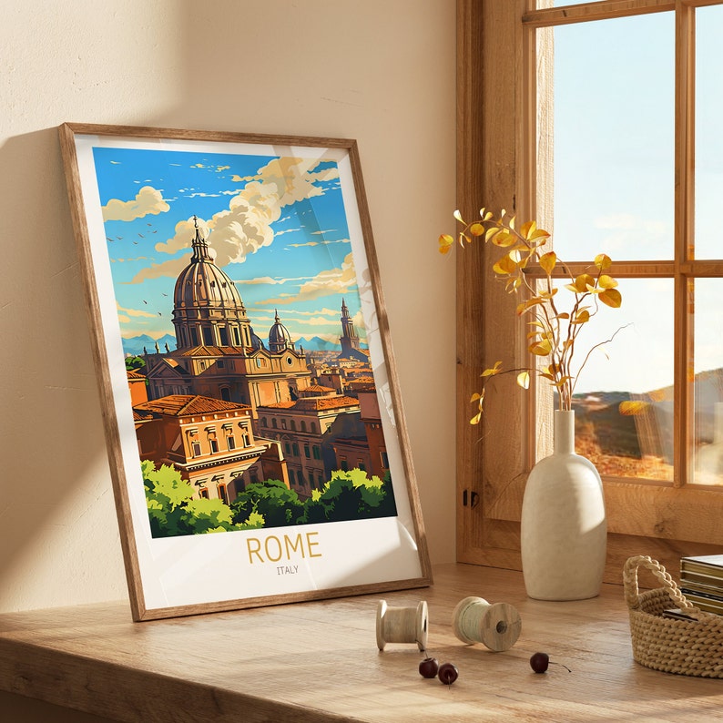 May include: A framed print of a colourful illustration of the city of Rome, Italy. The print features a large building with a dome and other buildings in the background. The print is framed in a light brown wood frame.