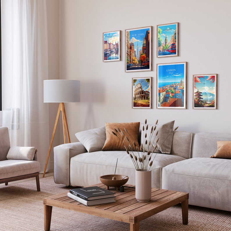 May include: A living room with a white couch, a wooden coffee table, a lamp, and a wall with framed travel posters of cities like New York, Lisbon, Rome, and Tokyo.