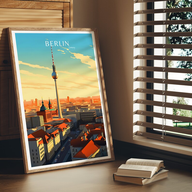 May include: A framed print of a cityscape with the Berlin Television Tower in the center. The print has a vintage travel poster aesthetic with the word "BERLIN" in a bold font at the top.