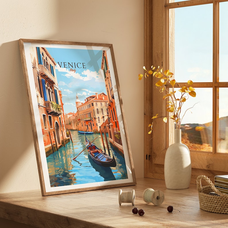 Puede incluir: Una impresi&oacute;n enmarcada de una pintura colorida que representa una g&oacute;ndola en un canal de Venecia, Italia. El texto "VENICE Italy" est&aacute; impreso en la esquina superior derecha de la pintura.