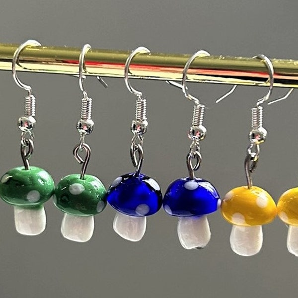 Colorful glass, small mushroom-shaped earrings adorned with polka dots
