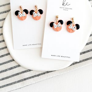Disney Minnie and Mickey Mouse Inspired Pumpkin Halloween Orange Black Polka Dot Bow Dangle Gold Earrings Handmade of Polymer Clay on Etsy by Katie Collins Design Co.