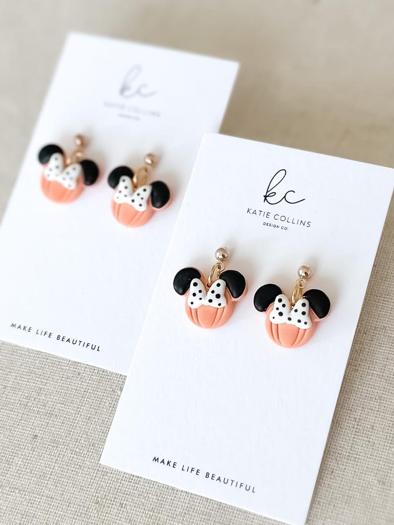 Disney Minnie and Mickey Mouse Inspired Pumpkin Halloween Orange Black Polka Dot Bow Dangle Gold Earrings Handmade of Polymer Clay on Etsy by Katie Collins Design Co.