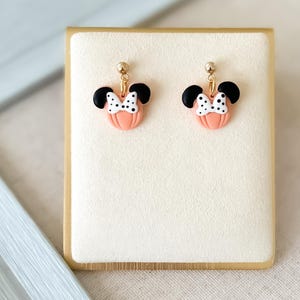 Disney Minnie and Mickey Mouse Inspired Pumpkin Halloween Orange Black Polka Dot Bow Dangle Gold Earrings Handmade of Polymer Clay on Etsy by Katie Collins Design Co.
