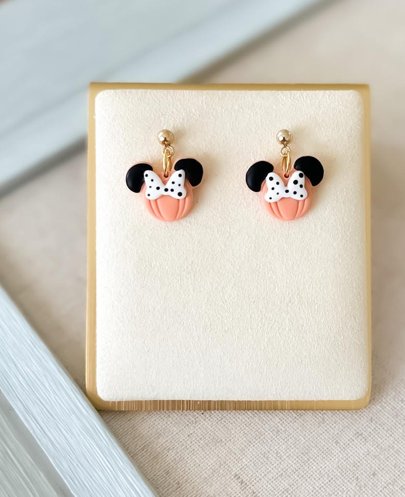 Disney Minnie and Mickey Mouse Inspired Pumpkin Halloween Orange Black Polka Dot Bow Dangle Gold Earrings Handmade of Polymer Clay on Etsy by Katie Collins Design Co.