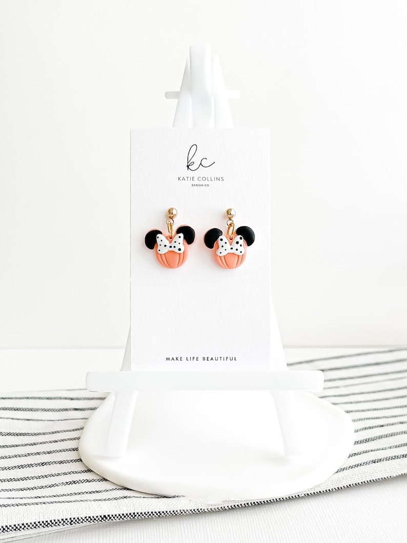 Disney Minnie and Mickey Mouse Inspired Pumpkin Halloween Orange Black Polka Dot Bow Dangle Gold Earrings Handmade of Polymer Clay on Etsy by Katie Collins Design Co.
