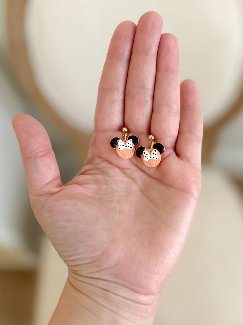 Disney Minnie and Mickey Mouse Inspired Pumpkin Halloween Orange Black Polka Dot Bow Dangle Gold Earrings Handmade of Polymer Clay on Etsy by Katie Collins Design Co.
