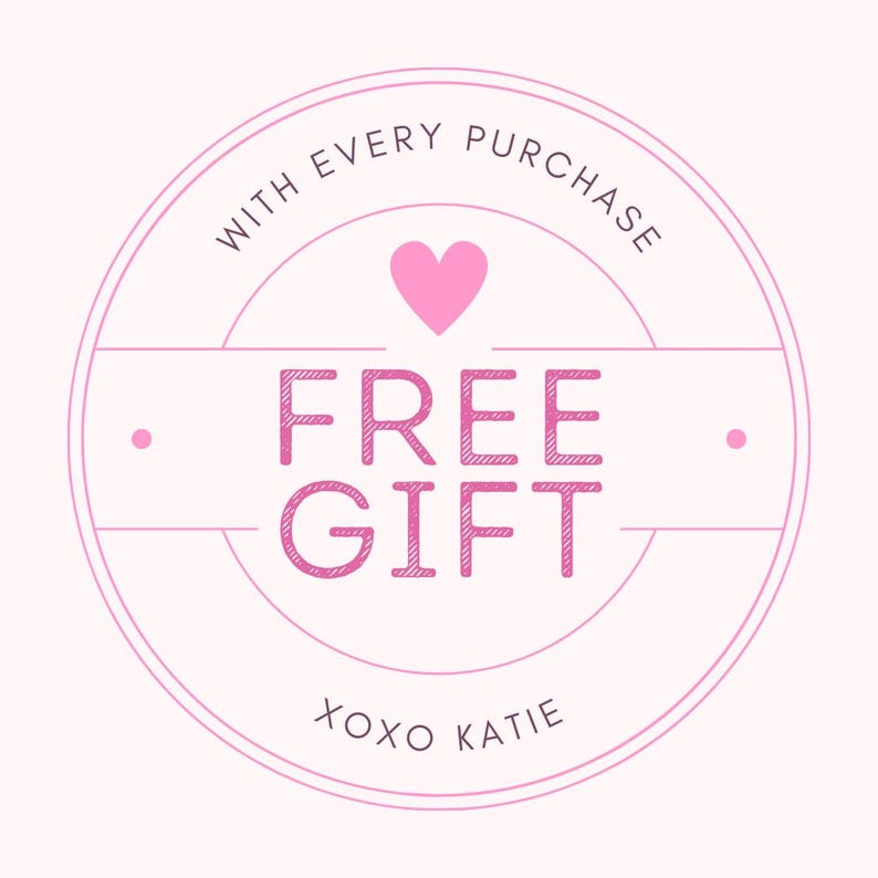 May include: A pink circle with the text "With every purchase, FREE GIFT xoxo Katie" and a pink heart in the center.