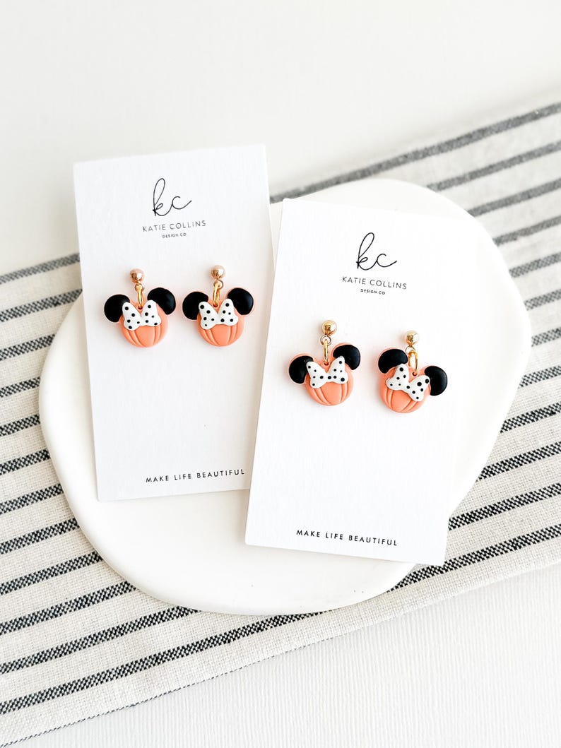 Disney Minnie and Mickey Mouse Inspired Pumpkin Halloween Orange Black Polka Dot Bow Dangle Gold Earrings Handmade of Polymer Clay on Etsy by Katie Collins Design Co.