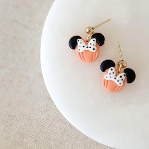 Disney Minnie and Mickey Mouse Inspired Pumpkin Halloween Orange Black Polka Dot Bow Dangle Gold Earrings Handmade of Polymer Clay on Etsy by Katie Collins Design Co.