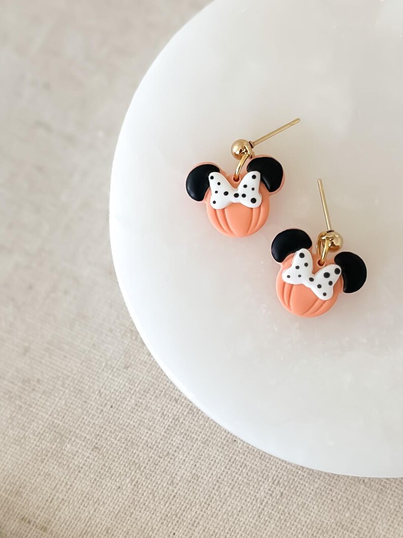 Disney Minnie and Mickey Mouse Inspired Pumpkin Halloween Orange Black Polka Dot Bow Dangle Gold Earrings Handmade of Polymer Clay on Etsy by Katie Collins Design Co.