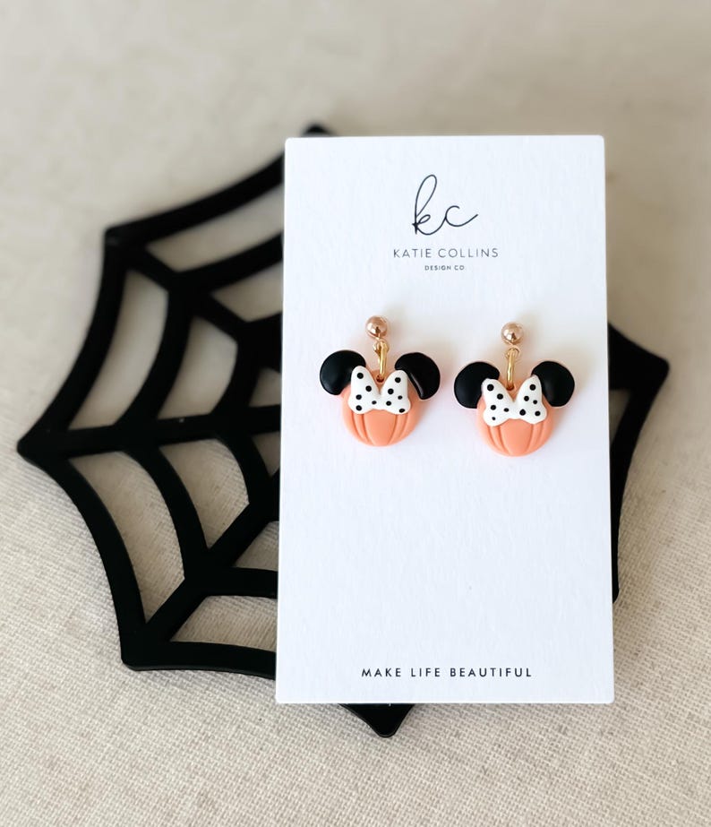 Disney Minnie and Mickey Mouse Inspired Pumpkin Halloween Orange Black Polka Dot Bow Dangle Gold Earrings Handmade of Polymer Clay on Etsy by Katie Collins Design Co.