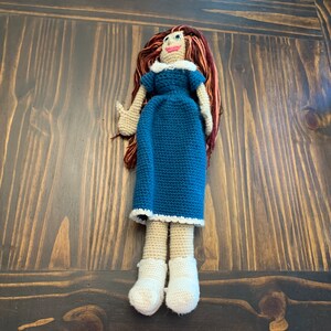 One of a kind doll with red hair and a blue dress