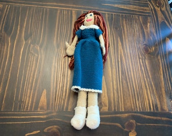 One of a kind doll with red hair and a blue dress