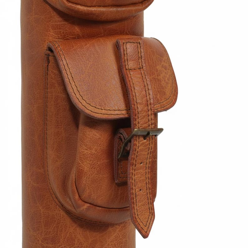 Zoom in picture of leather golf bag vintage style showing pocket with brass buckle.One of the 8 colors available of vintage leather buffalo hide leather golf bag. Handmade personalized golf gift for golfer. A great retirement gift, christmas gift ideas for him, gift for him. Vintage tan leather golf bag made of real leather with golf clubs inside the bag. golf bag have 2 pockets and brass accessories. engraving option is also available for this golf bag.
