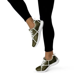 Zapatillas deportivas Evolve Signature con líneas cruzadas en blanco y negro para mujer