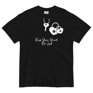 May include: Black t-shirt with a white graphic of a key and two heart-shaped locks. The text "Keep Your Heart On Lock" is printed below the graphic in a cursive font. The shirt is made of a soft, comfortable material.
