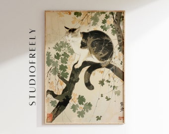 May include: A framed vintage print of a cat perched on a tree branch, surrounded by leaves. The cat has white and brown fur. The print has a beige background and is in a wooden frame. The text "STUDIOFREELY" is printed vertically on the left side of the frame.