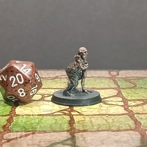 Hand Painted undead ghoul zombie flesh eating miniature for Dungeons and Dragons and other table top role-playing games. 28mm