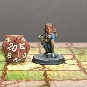 Hand Painted female Dwarf fighter rogue cleric adventurer miniature for Dungeons and Dragons and other table top role playing games.