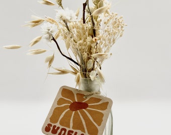 Small white dried flower bouquet with vase