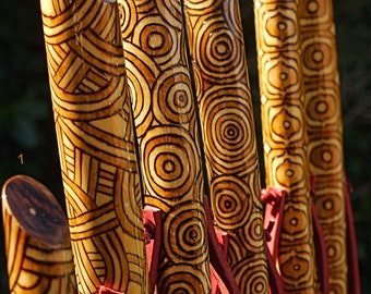 Handmade walking sticks made of wood and decorated with pyrography and painted