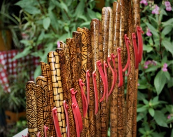 Handmade walking sticks made of wood and decorated pyrography