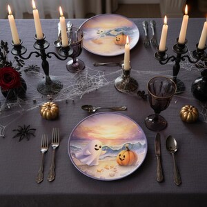 May include: A Halloween-themed table setting with plates featuring a ghost and pumpkin design. The table is decorated with candles, spiderwebs, and golden pumpkins. Silverware and dark purple goblets complete the festive look.