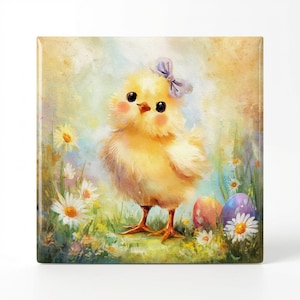 May include: A square, watercolor-style image of a fluffy yellow chick with a light purple bow. The chick stands in a field of daisies and grass, with two decorated Easter eggs in the background. The overall theme is Easter and springtime.
