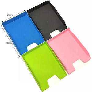 May include: Four plastic file trays in blue, black, green, and pink. Each tray measures 34cm by 25cm.