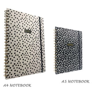 May include: Two spiral bound notebooks with black and white polka dot covers. The larger notebook is labelled "A4 Notebook" and the smaller notebook is labelled "A5 Notebook". Both notebooks have a black elastic band closure and the word "NOTES" printed in gold on the front cover.