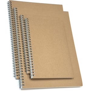 May include: Several spiral-bound notebooks with kraft paper covers. The notebooks have silver metal spiral bindings and are arranged in a layered fashion, showing their rectangular shape and the natural brown colour of the paper.