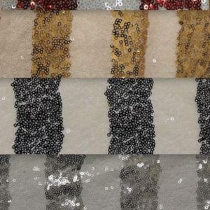 May include: A close-up of a fabric with a striped pattern made of sequins. The fabric is in a variety of colors, including red, gold, silver, and black.