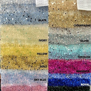 May include: A swatch card showing 10 different colors of fabric with sequins. The colors are: white, slate, ivory, yellow, gold, sky blue, orchid, red, champagne, silver, turquoise, magenta, royal, olive, and black.