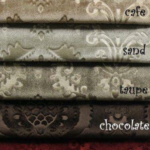 May include: A close-up of ten fabric swatches in various colors and patterns. The swatches are arranged vertically, with the lightest color at the top and the darkest color at the bottom. The colors are white, ivory, cafe, sand, taupe, chocolate, burgundy, gold, and navy. The fabric has a damask pattern.