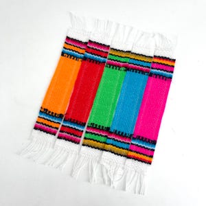 May include: Set of six colorful woven fabric strips with white fringe. The strips are orange, red, green, blue, and pink with black and white stripes.