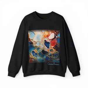May include: Black sweatshirt with a colorful abstract design featuring swirling blue, orange, and yellow paint. The text "Colour Rivers." is printed in the bottom right corner.