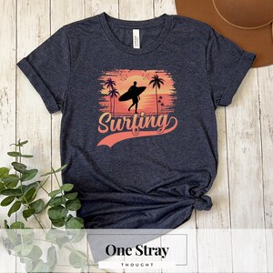 Sunset Surfing T-Shirt: Unisex Beach Vibes Graphic Tee