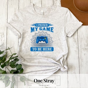 I Paused My Game To Be Here T-Shirt - Funny Gamer Graphic Tee - Gaming Enthusiast Apparel | Unisex T-Shirt, Gift For Gamers
