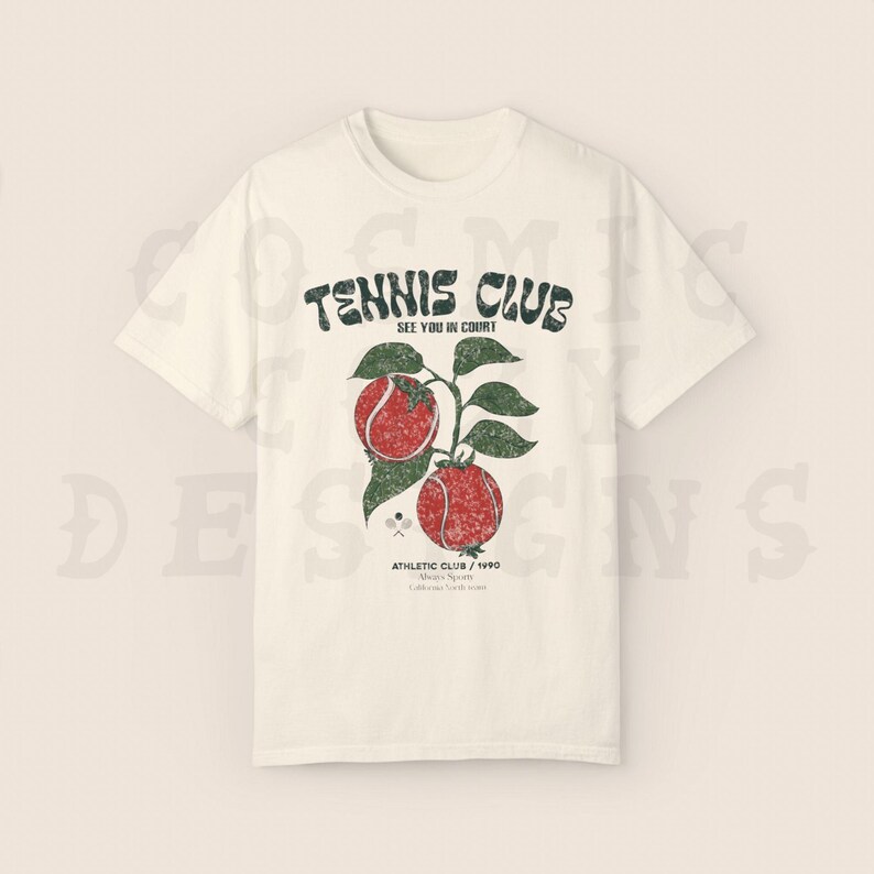 May include: White t-shirt with a vintage-style graphic of tennis rackets and tennis balls. The text on the shirt reads "Tennis Club See You In Court Athletic Club / 1990"