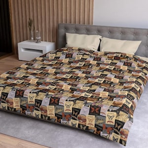 May include: A patchwork quilt featuring a repeating pattern of butterfly postage stamps in shades of brown, tan, and black. The quilt is spread over a bed with cream-colored pillows and a gray headboard. The overall theme is vintage and nature-inspired.