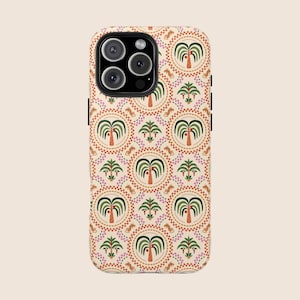 May include: A phone case featuring a repeating pattern of green palm trees, pink flowers, and orange circles on a cream background. The case has a protective design with a camera cutout and black side buttons.