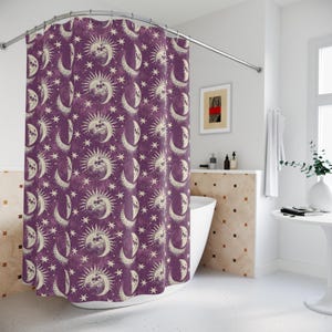 May include: Purple shower curtain featuring a vintage design of moons, stars and suns. The pattern is in a cream colour.