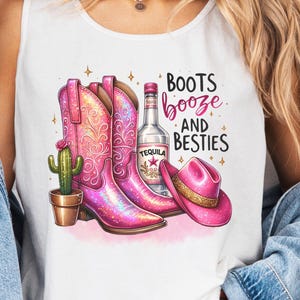 May include: White tank top with a pink glitter cowboy boot, a bottle of tequila, and a pink cowboy hat. The text on the shirt reads "Boots Booze and Besties".