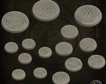 May include: A collection of pre-supported, gray, circular bases with textured surfaces. The bases vary in size and feature different patterns, including cracked earth and brickwork. The text "PRE-SUPPORTED" is visible at the bottom.