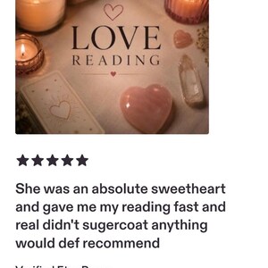 May include: A beige surface featuring the text LOVE READING with a small heart icon above and below the word LOVE. Three lit candles in glass holders, a deck of tarot cards, a heart-shaped pink crystal, and a clear crystal point are arranged.
