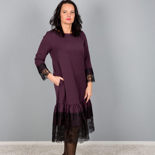 Dress Aubergine color with pockets and laces. Free delivery and ready to ship.