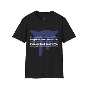 May include: Black t-shirt with a blue abstract design and the text "Puppets Can't Control You" in white and blue. The shirt is a crew neck style and appears to be made of cotton.
